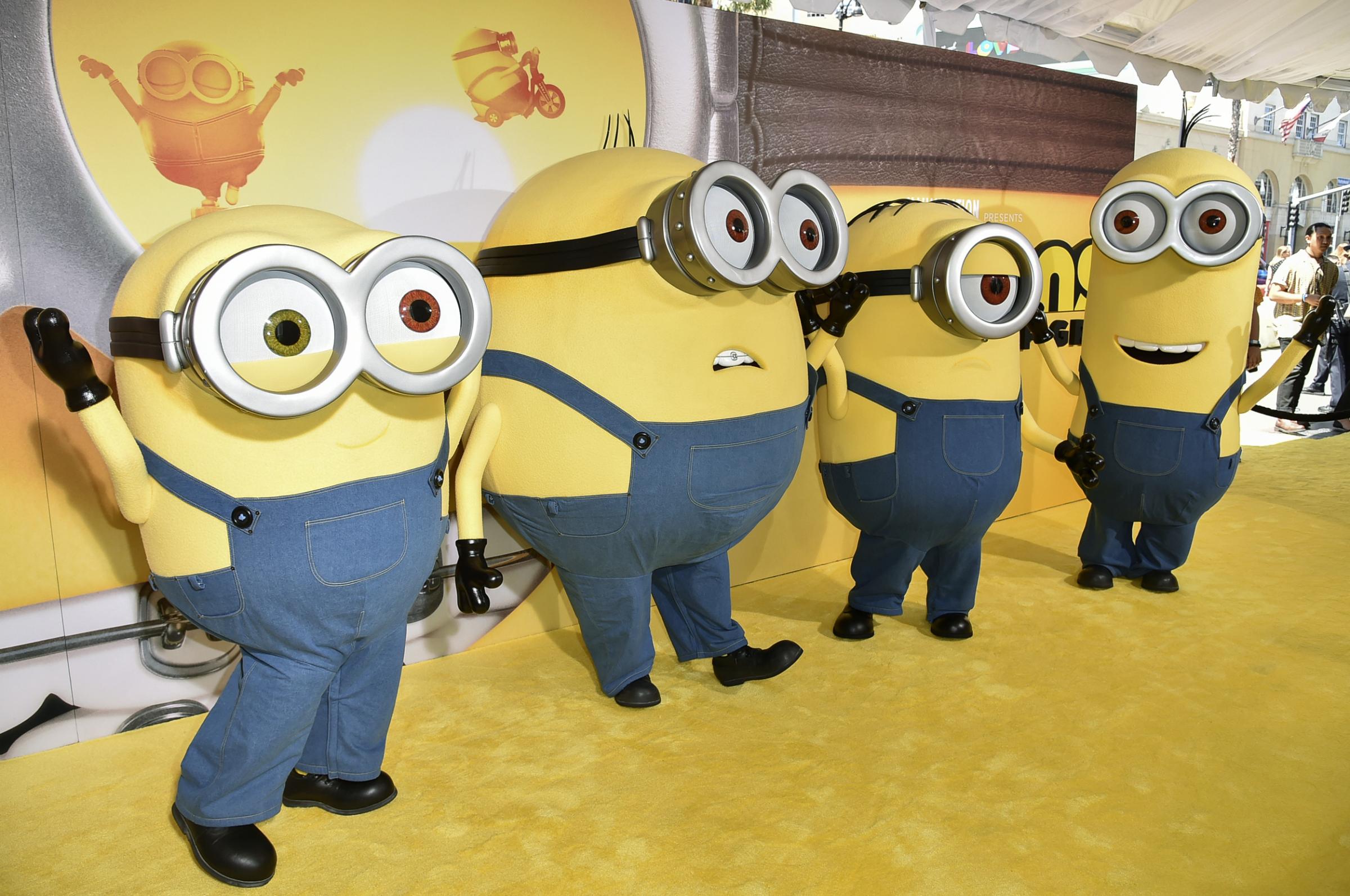 Minions Bob, from left, Otto, Stuart and Dave arrive at the Los Angeles premier of Minions: The Rise of Gru, on Saturday, June 25, 2022, at the TCL Chinese Theatre in Los Angeles. (Photo by Richard Shotwell/Invision/AP)