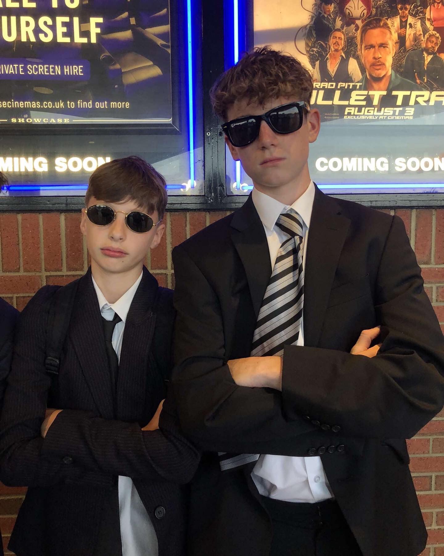 Freddie Austin, 14, left and a friend boys pose inside Showcase Cinema